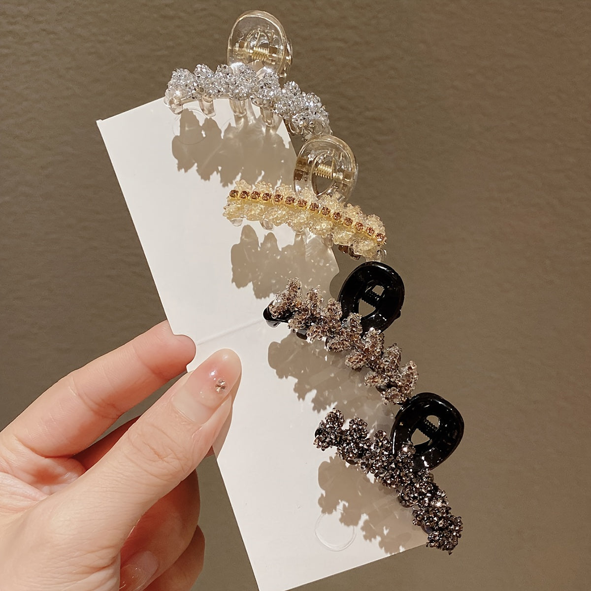 4 elegant rhinestone hair claw clips with small wheat sheer design in black, brown, and clear.