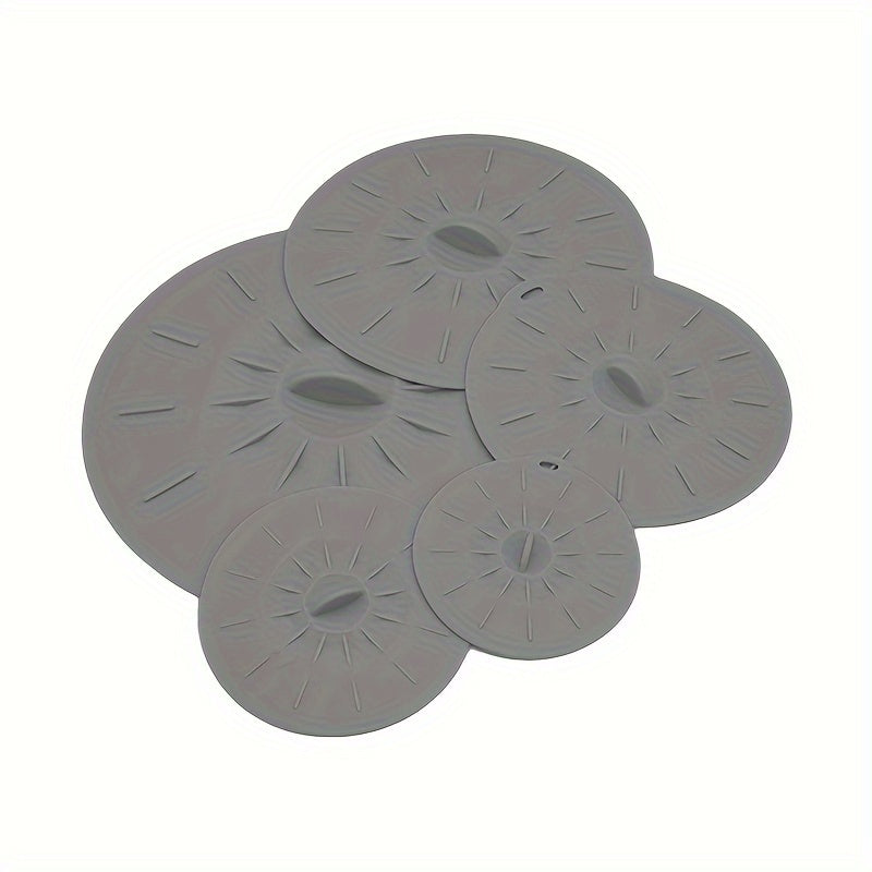 5 reusable silicone microwave lid covers in various sizes for bowls, cups, plates, pots, and pans. Can be used as microwave splatter covers, for stovetop, oven, fridge, and freezer. BPA free.