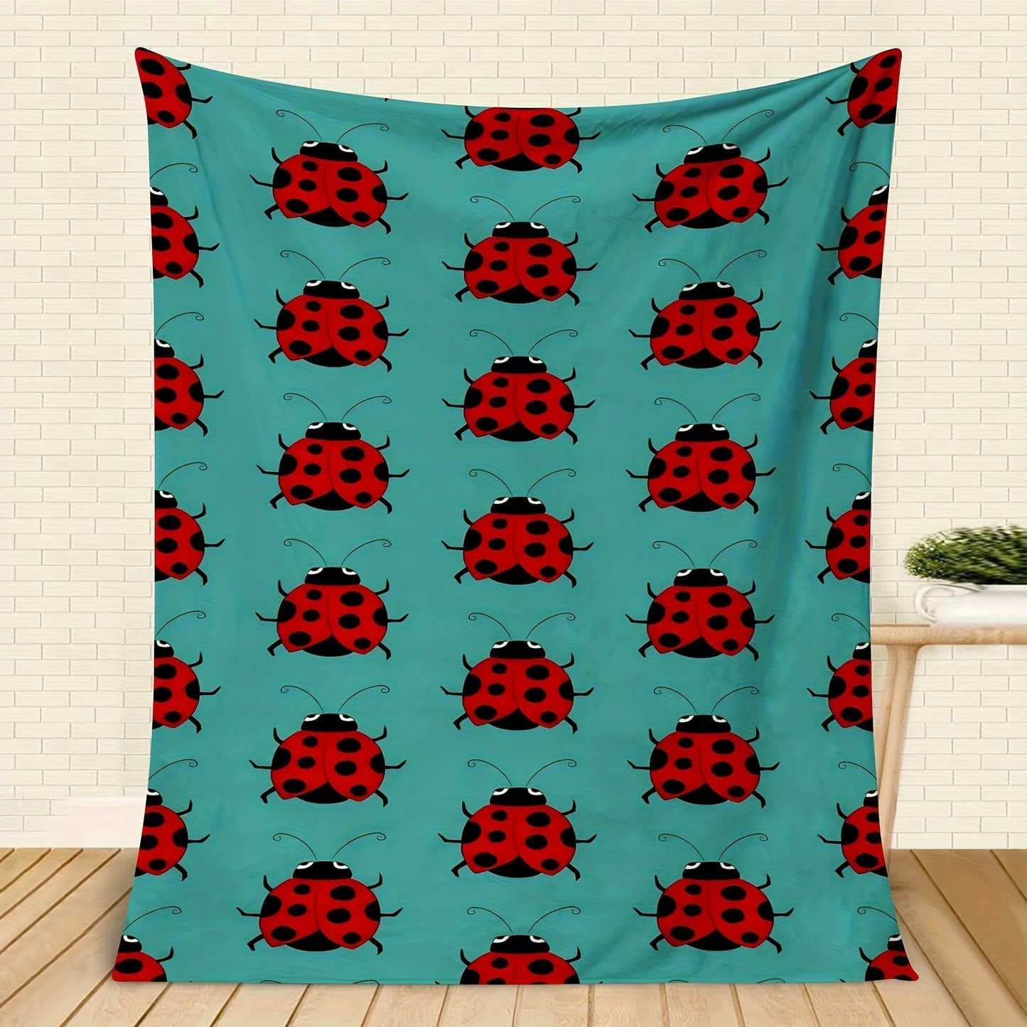 Stay warm and stylish with our cozy ladybug print flannel throw blanket. This soft and versatile blanket is perfect for your couch, bed, office, or travel. It is machine washable and makes a great gift idea for any season.