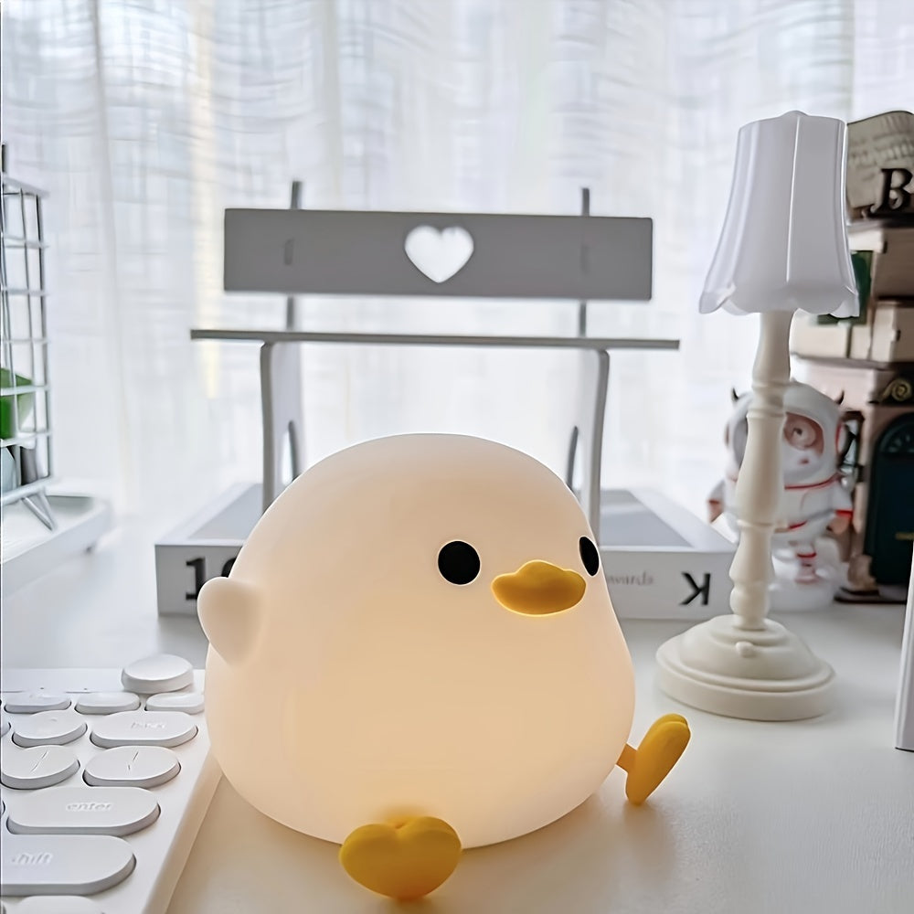 Cute duck-shaped touch control night light with RGB color changing, soft silicone bedside lamp, USB-C rechargeable desk light, perfect gift for any room.