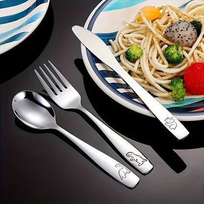 - Set of stainless steel flatware for youngsters
- Cartoon dinosaur design
- Silvery knife, fork, and spoon