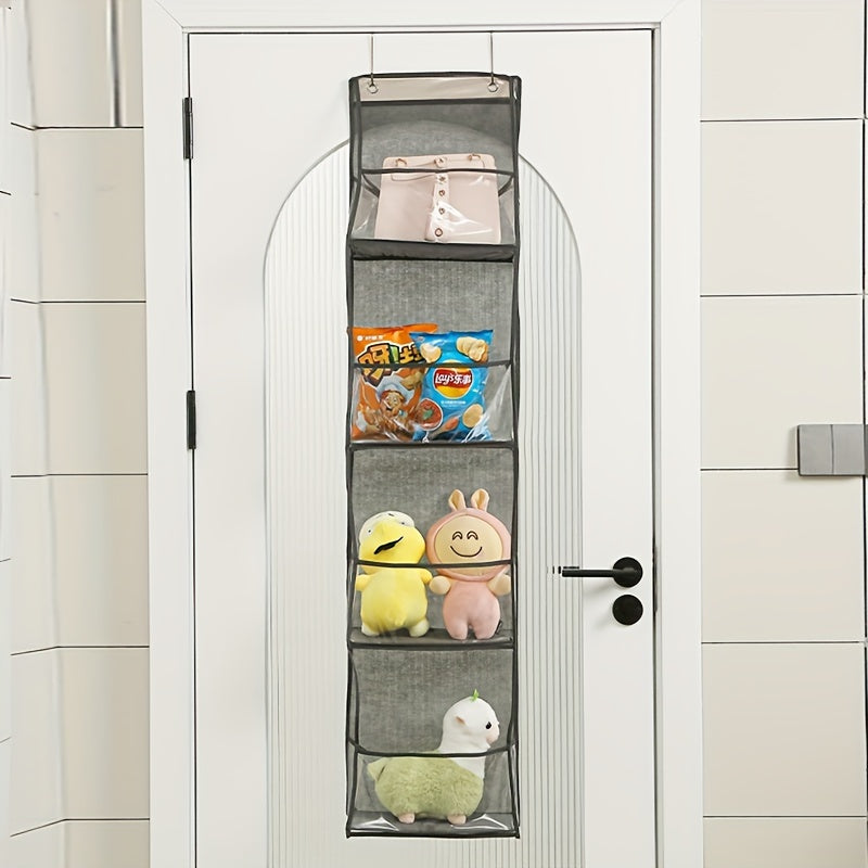 Wall-mounted storage bag with multiple layers for dormitory use, designed to hang behind doors and featuring a transparent design for visibility and multifunctional storage.