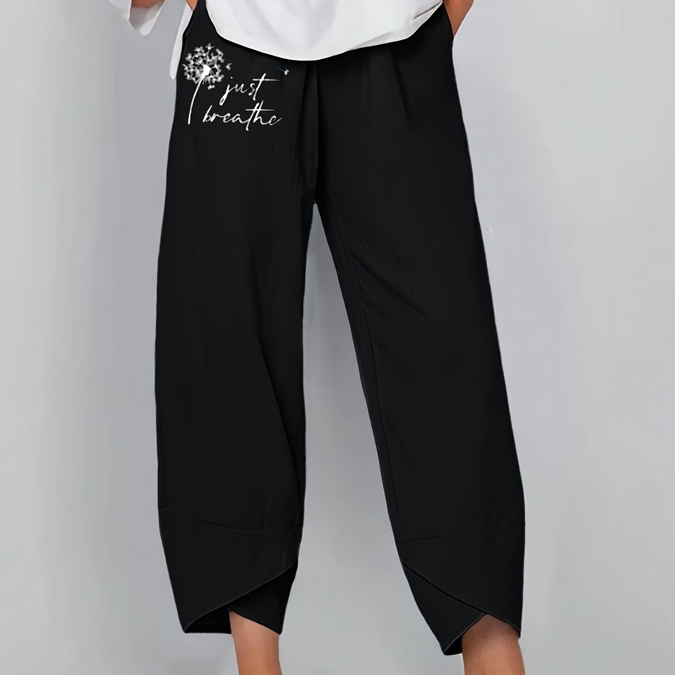 Baggy pants with dandelion print for plus size women, suitable for spring and fall.