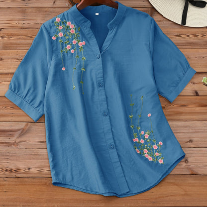 Floral embroidered women's blouse with v-neck and short sleeves, made of rayon and polyamide. Machine washable, ideal for spring and summer.