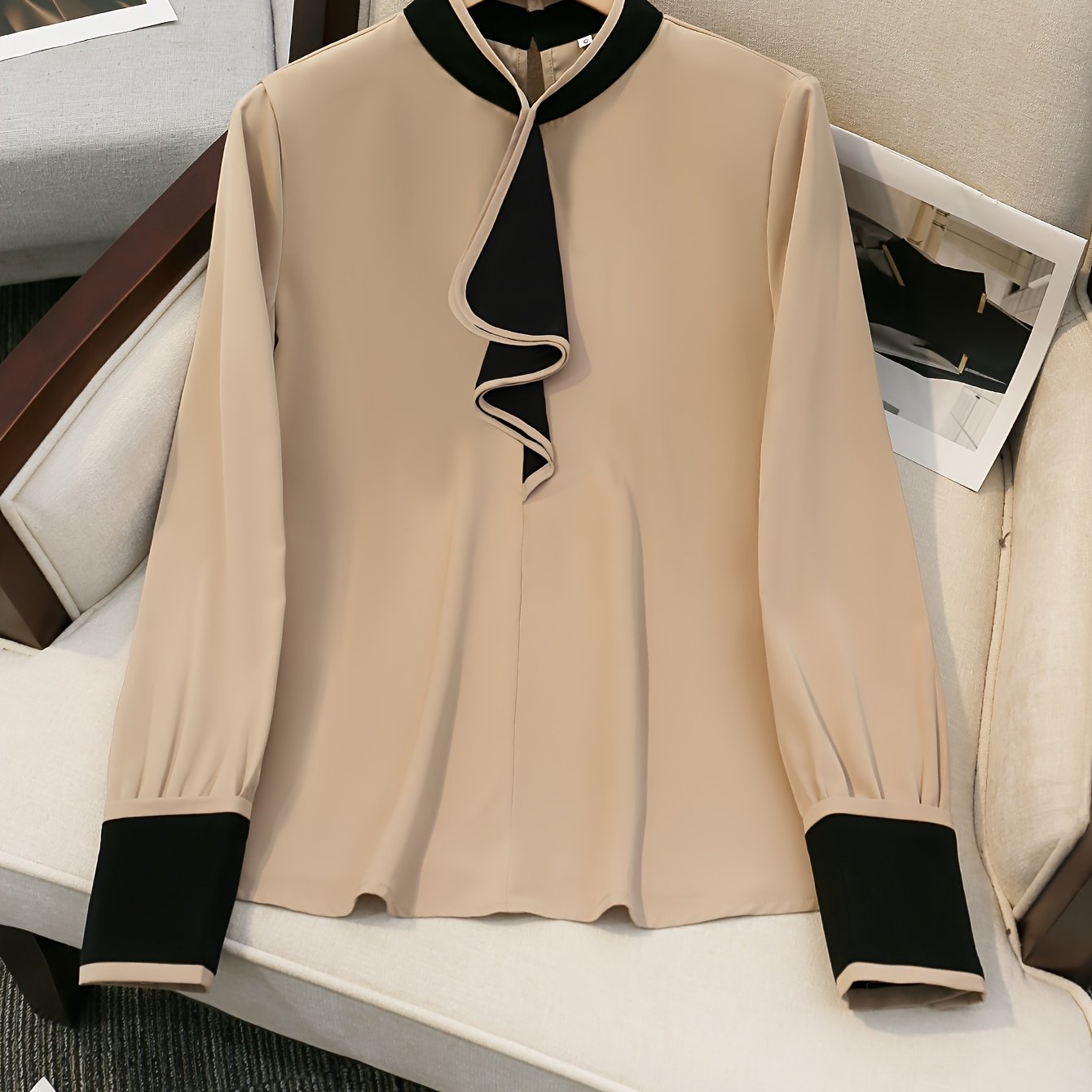 Women's beige blouse with black ruffle trim, contrast collar, long sleeve, made of polyester, machine washable, all-season chic top with tailored fit.