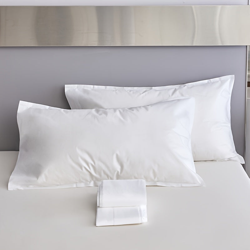 Two pieces of sterile disposable travel pillow covers with sealed envelopes. They are partially cleaned, pure white, and made of thick breathable non-woven polyester. Ideal for travel, hotels, and salons. The covers are unprinted and come in a pair. Use