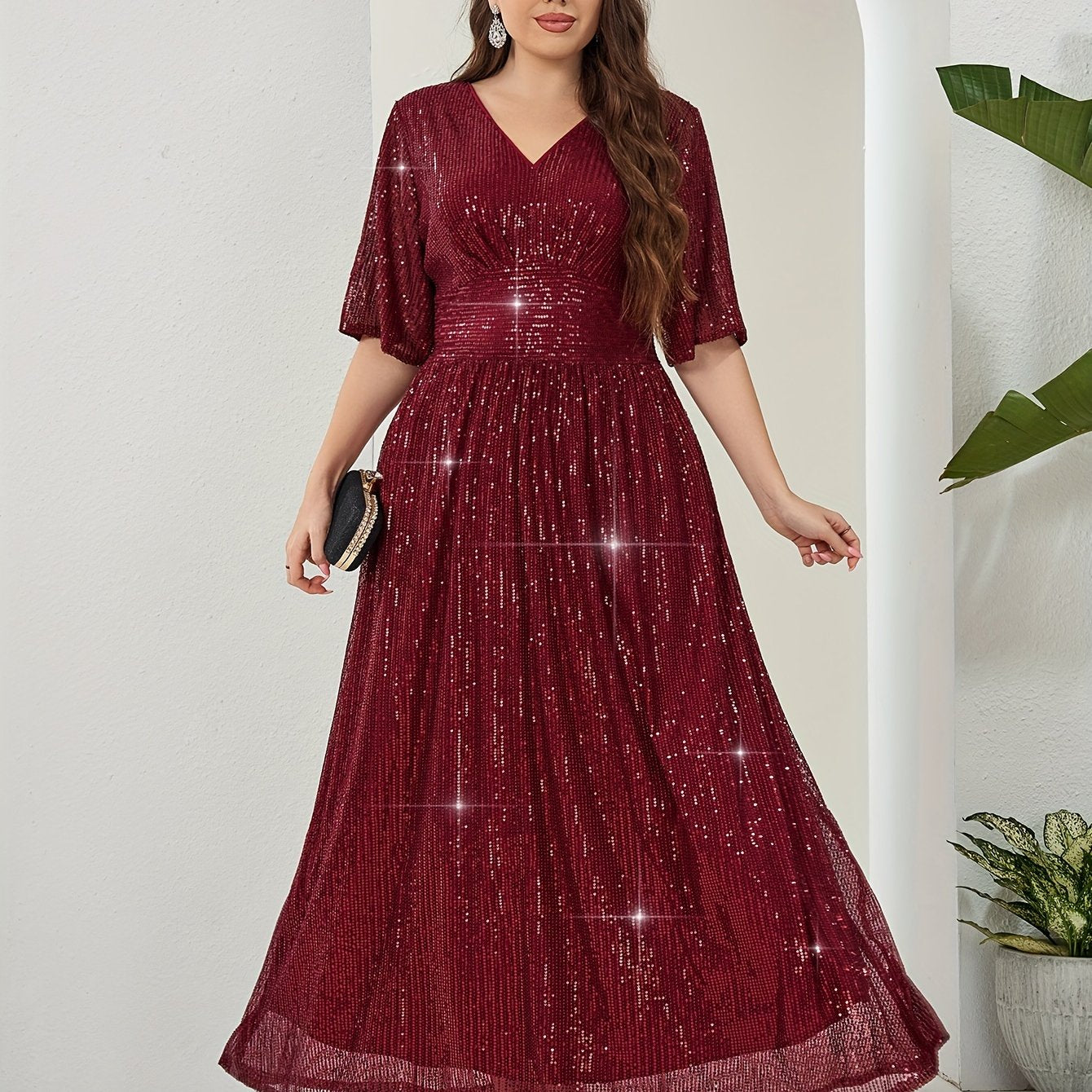 Elegant plus-size sequin maxi dress with v-neck and half sleeves. Made of non-sheer polyester with zip detail. Suitable for all seasons.