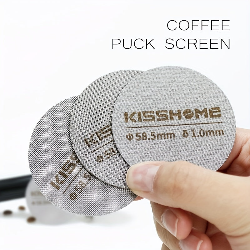 Reusable espresso puck screen made of 316 stainless steel, heat resistant, available in diameters of 51mm, 53.5mm, and 58.5mm. Compatible with Breville machines and 51mm, 54mm, and 58mm portafilters. Includes coffee accessories.