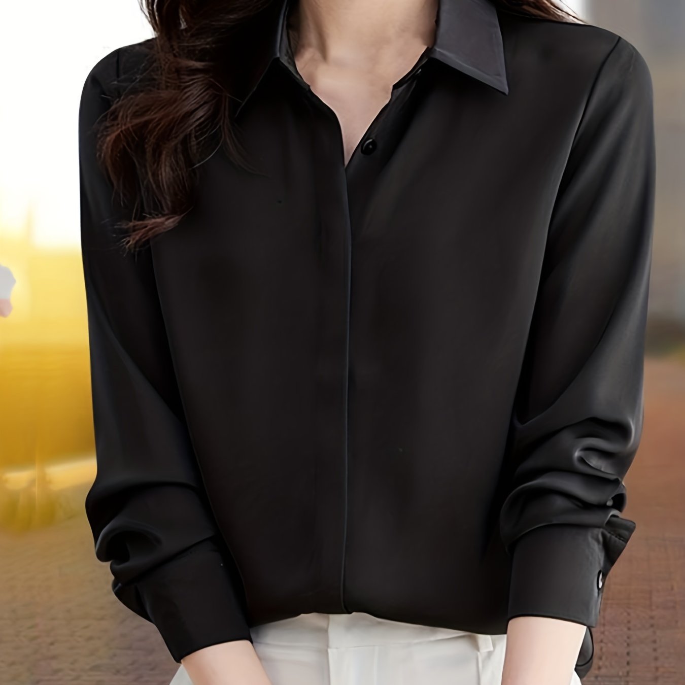 Elegant black long sleeve shirt for women, perfect for all seasons made of non-stretch polyester fabric.