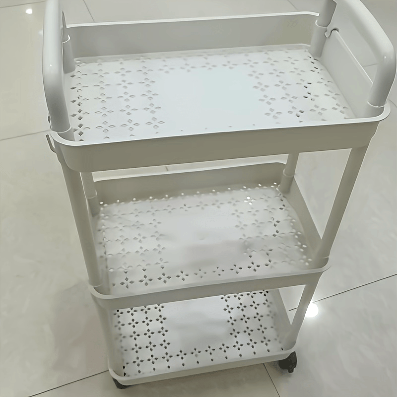 A flexible rolling storage cart on wheels that serves as a multi-tier organizer for snacks and books. Perfect for the kitchen, bedroom, or living room, this space-saving plastic shelving unit is both practical and versatile.