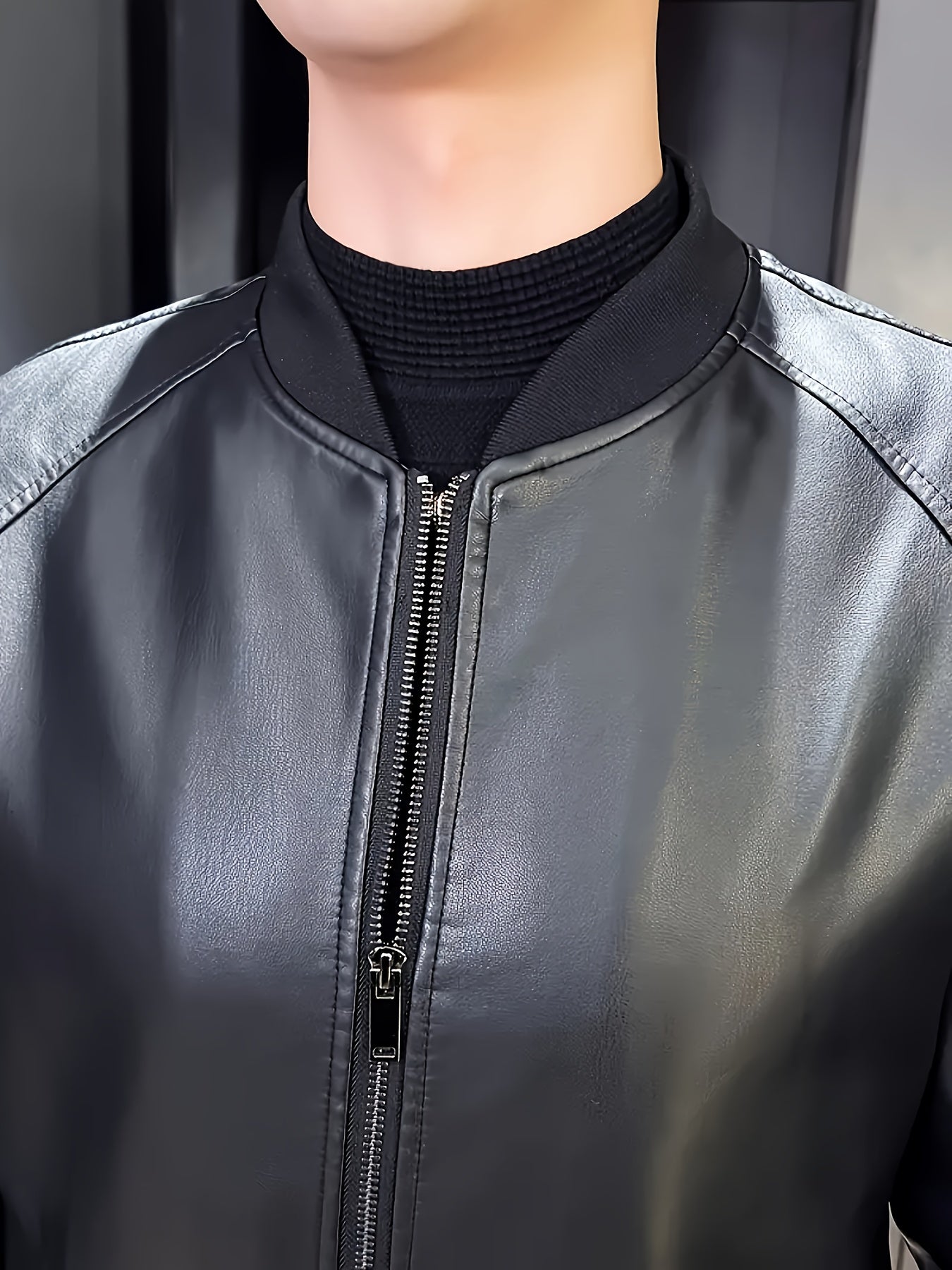 Stylish men's black PU leather jacket with casual baseball collar, zip-up pockets, loose fit, and machine washable - perfect for casual attire.