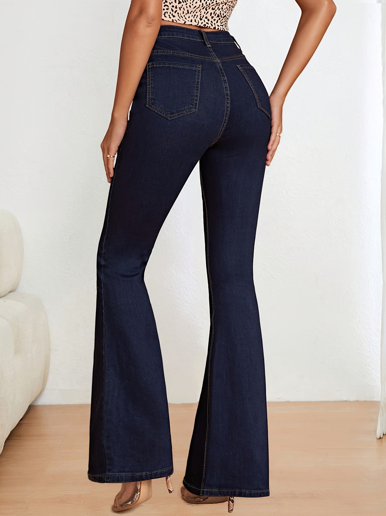 Blue stretch denim flare jeans for women, slim fit, high-waisted with button closure, machine washable.