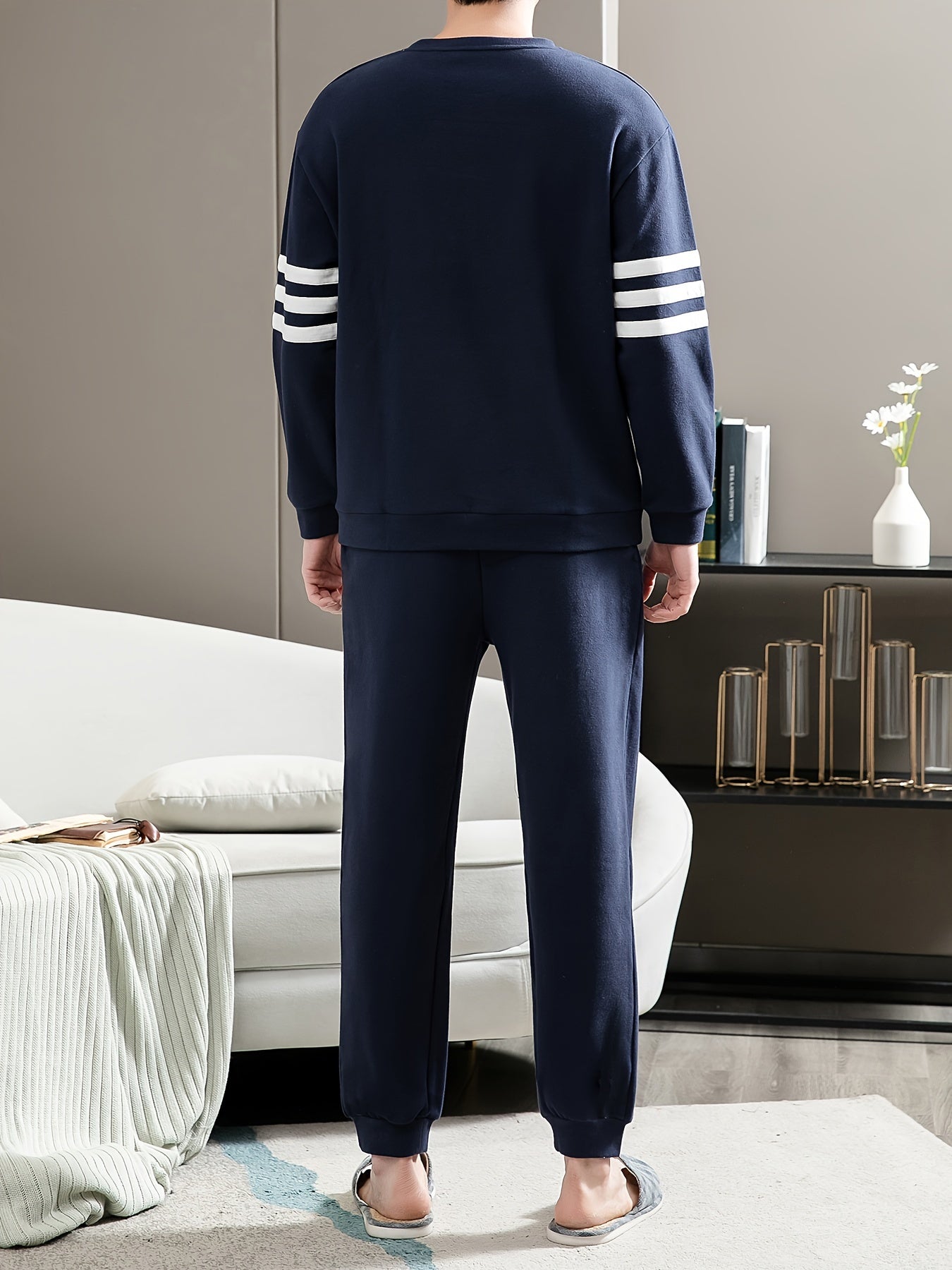 Casual cotton pajamas set for men with letter graphic print, long sleeve crew neck top with chest pocket and loose pants. Suitable for spring and autumn.