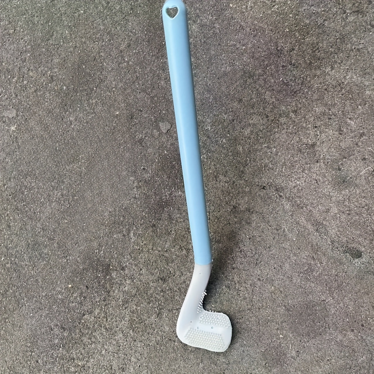 Golf toilet brush with long handle for wall mounting in household bathrooms.