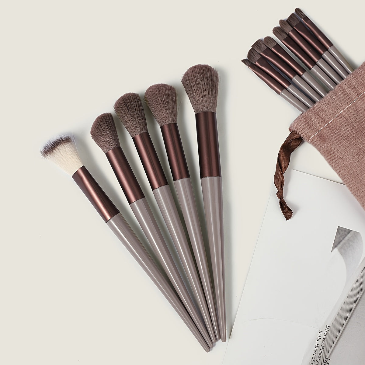 13-piece Makeup Brush Set with ultra soft, quick-dry bristles and matching fabric storage bag. Ideal for beauty enthusiasts.