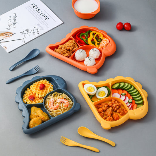 Children's dinnerware set shaped like dinosaurs - made of BPA-free plastic includes plate, bowl, fork, and spoon.