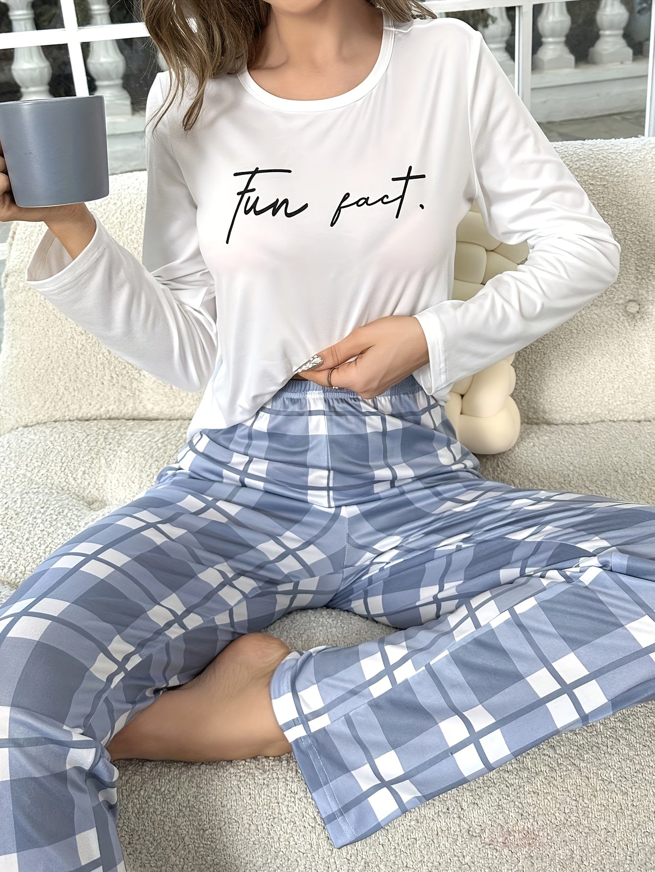 Women's pajama set with letter print top and plaid pants, perfect for sleep and lounging.