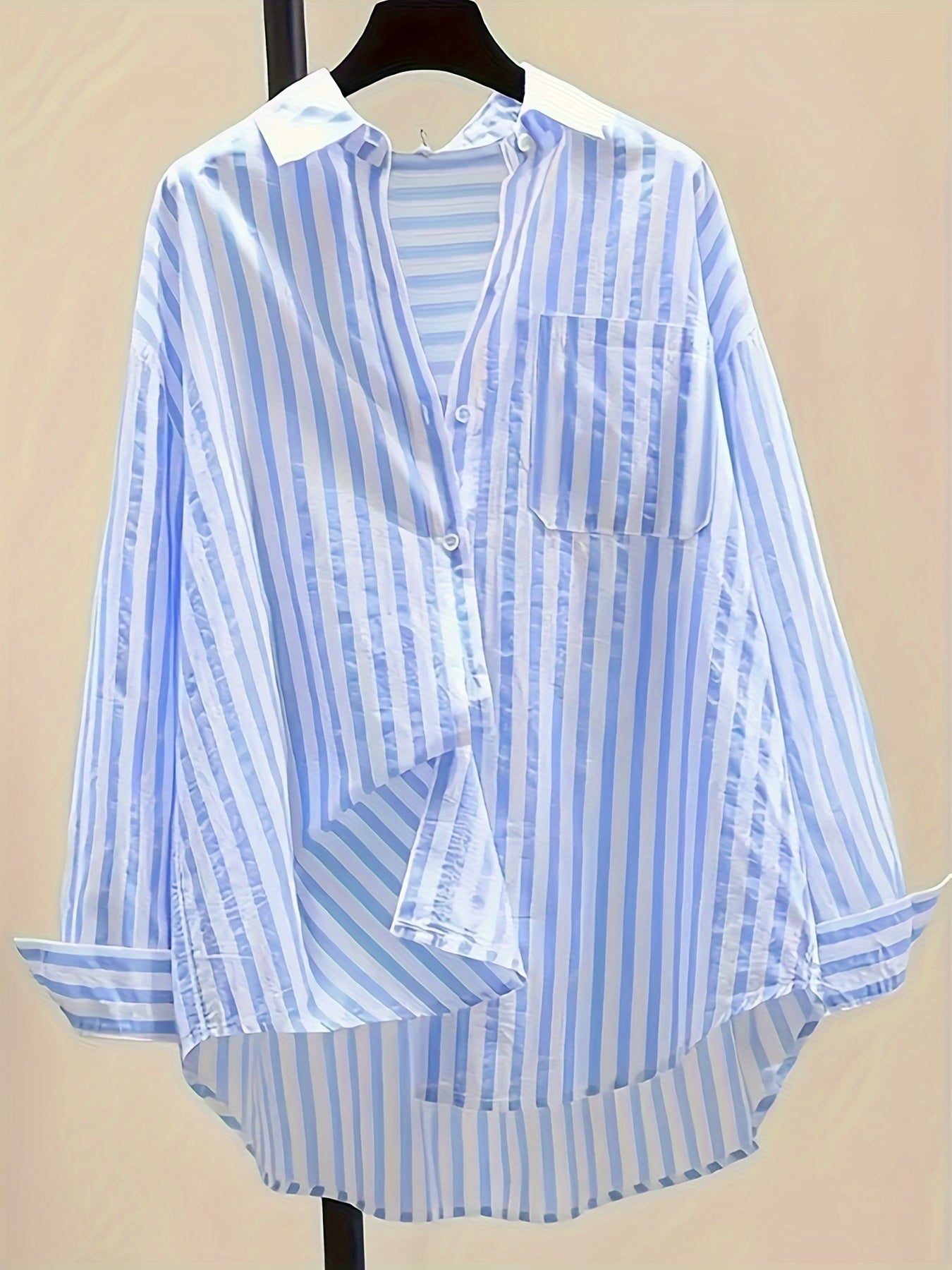 Women's blue and white striped long sleeve button-up shirt with collar, chest pocket. Made of lightweight polyester, machine washable. Suitable for all-season casual or dressy wear.