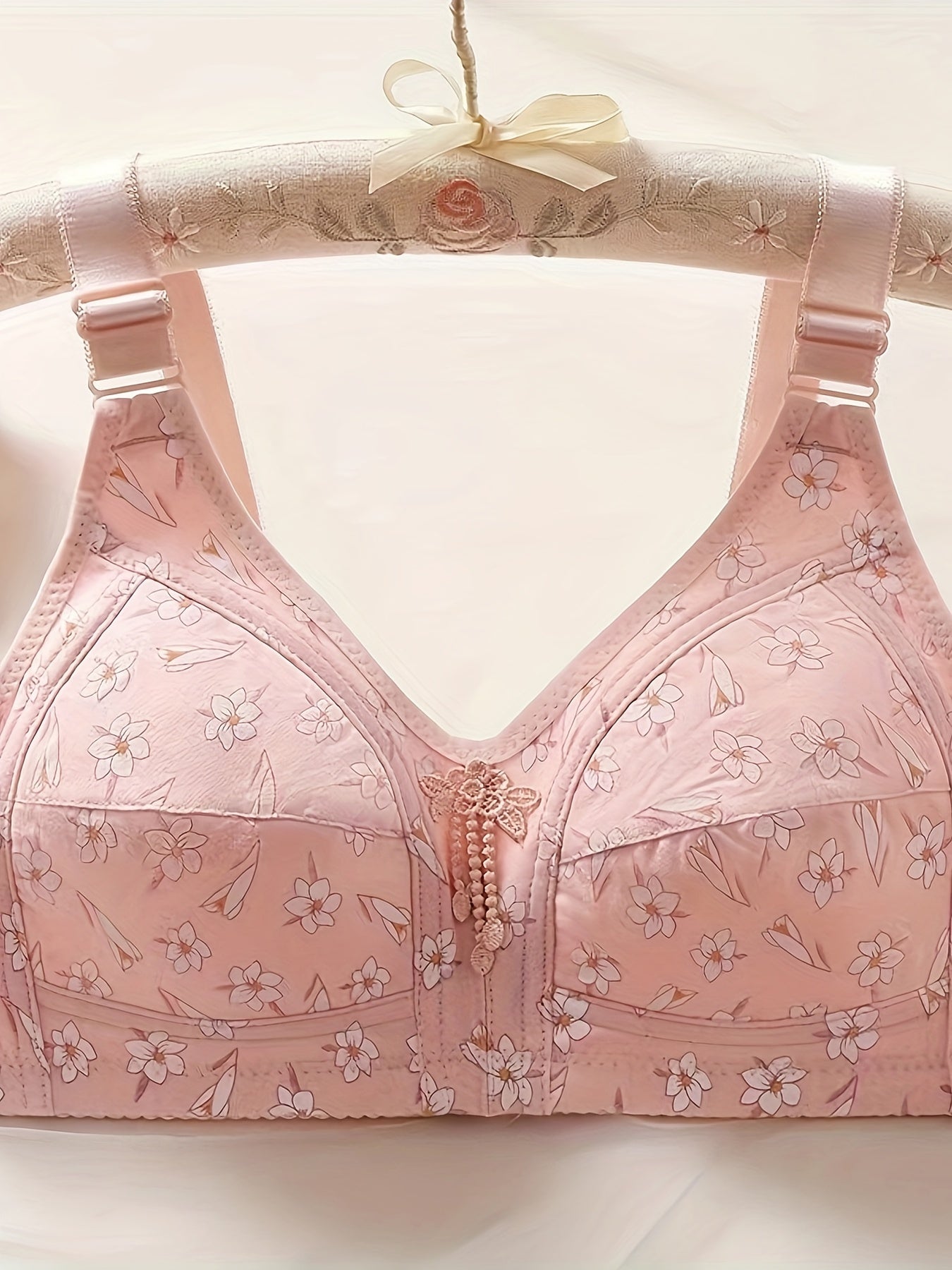 Set of 3 elegant floral applique wireless bras with high support push-up design and comfortable breathable fabric for adults.