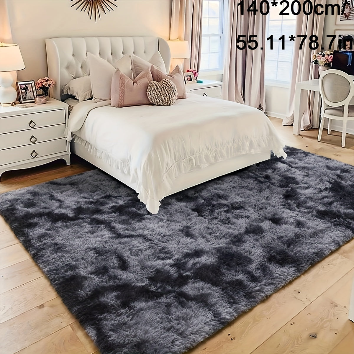 Soft plush area rug in deep grey tie-dye design, perfect for adding a cozy touch to your bedroom or living room. Made of fluffy polyester shaggy material, this carpet is ideal for festive Christmas decor. Rectangular in shape, this rug should be dry