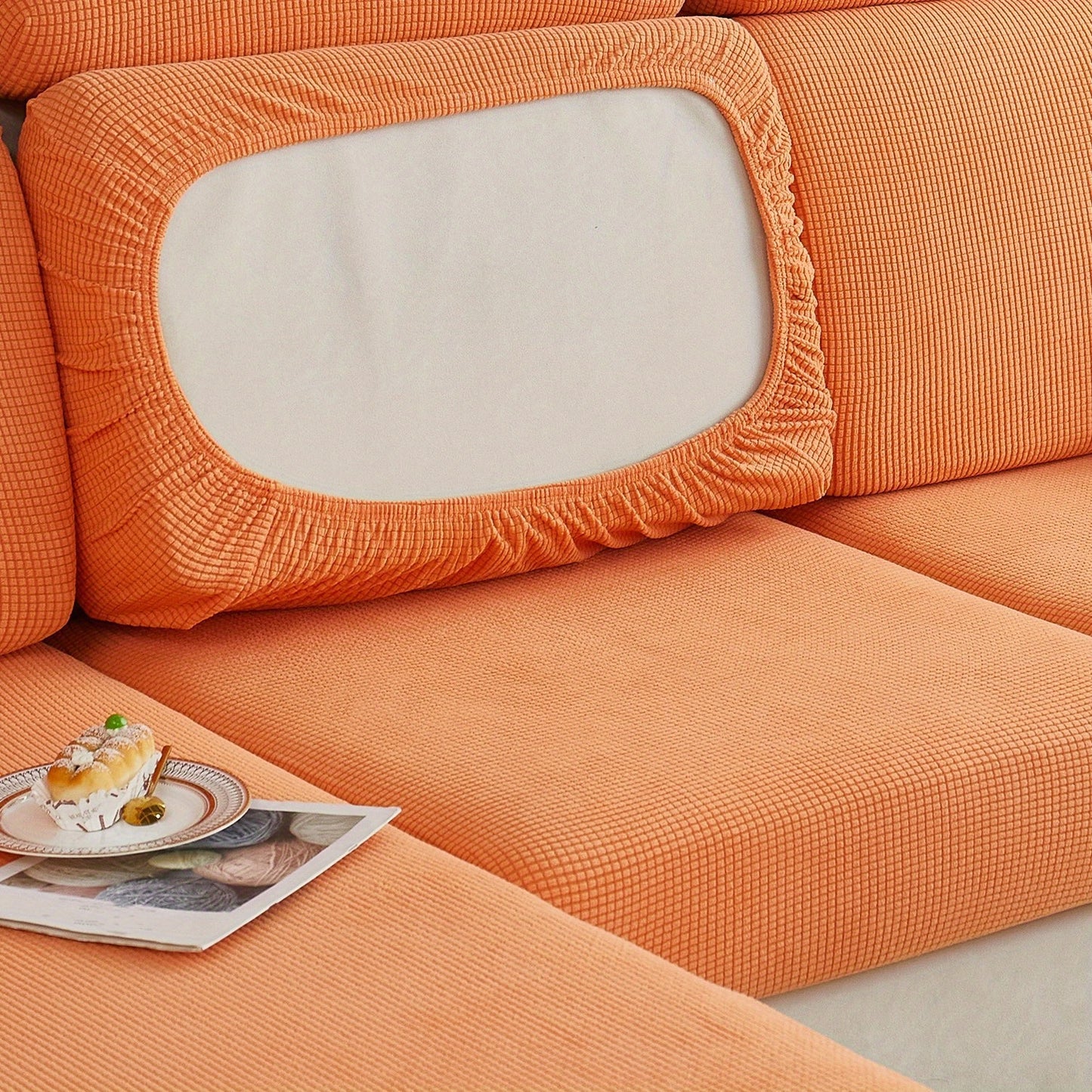 Durable sofa cover protects furniture from spills and stains.