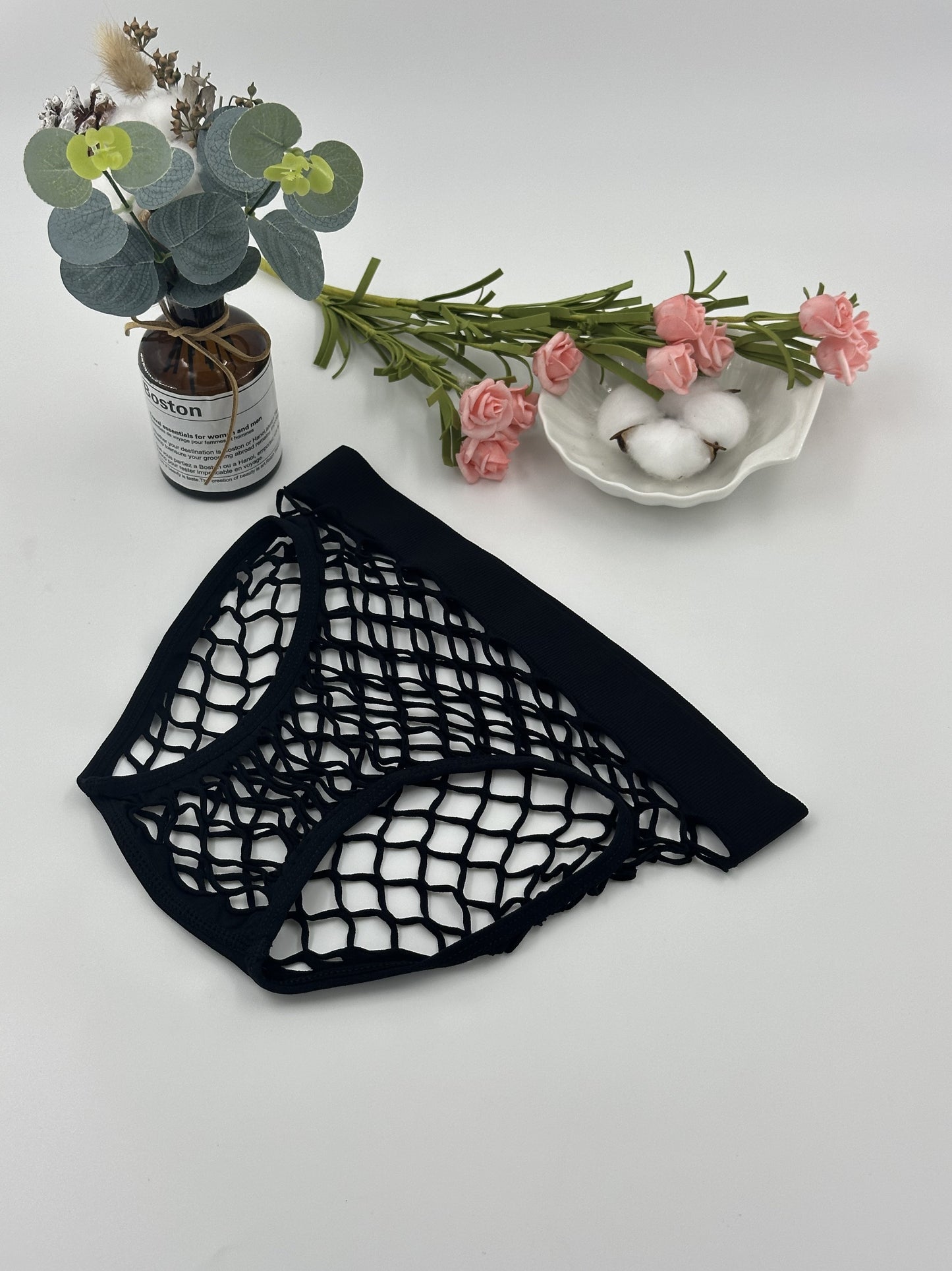 Women's sexy mesh panties made of nylon knit, with a seductive triangle brief design and seamless, breathable fabric.