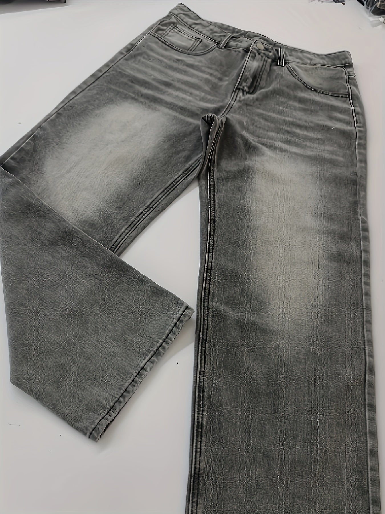 Men's extra long loose-fit denim jeans with a geometric-patterned cotton blend, non-stretch fabric, zipper fly closure, and washed finish for street style that is versatile in all seasons.