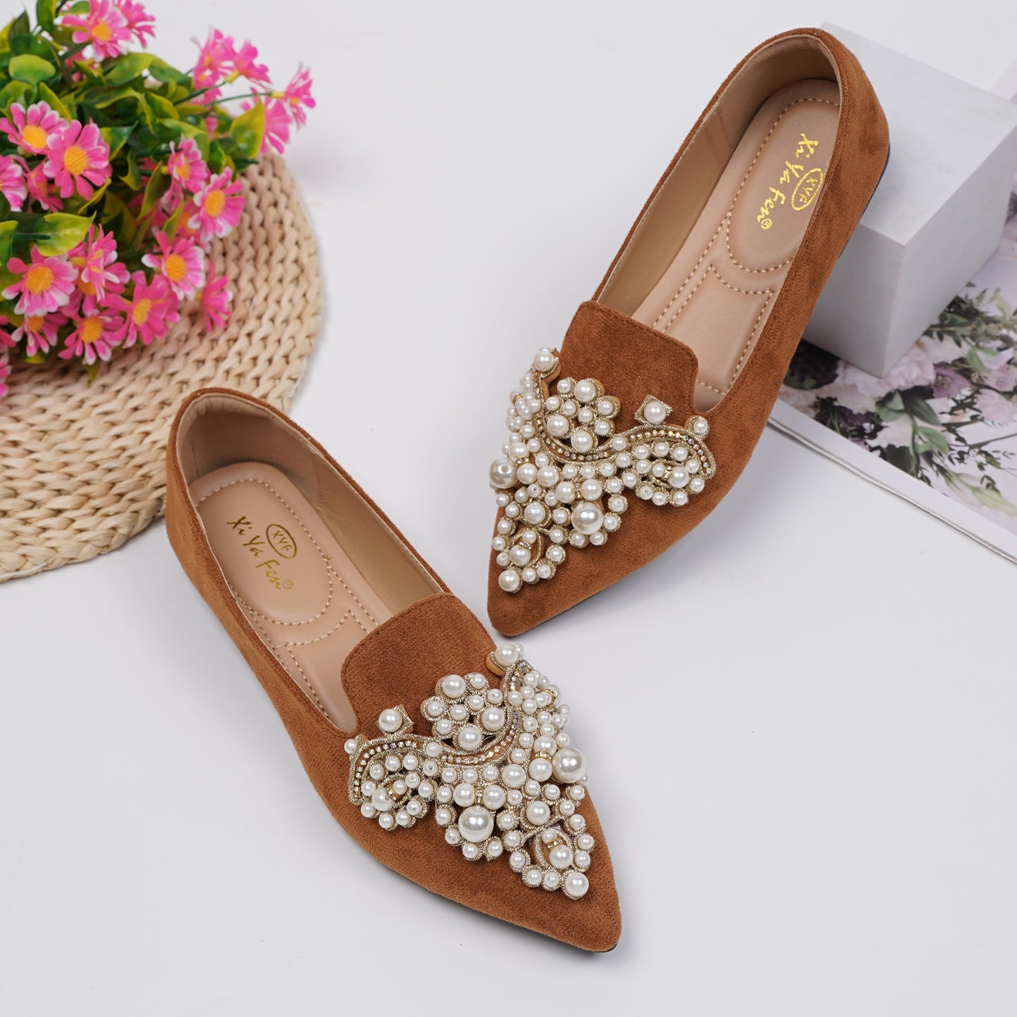 Women's elegant flat shoes with faux pearl decoration, point toe design, and lightweight comfort.