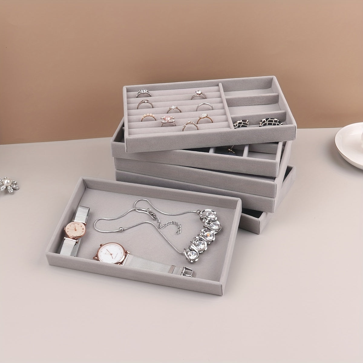 1 piece Grey Velvet Jewelry Tray with compartments for necklaces, bracelets, earrings, rings, bangles, and watches, with a velvet drawer for organization.