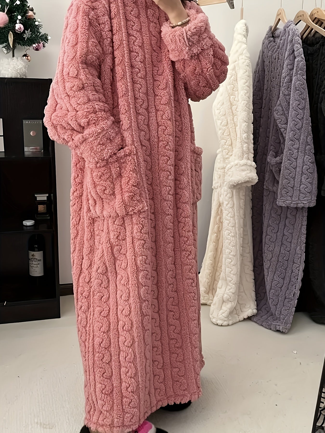 Cozy coral fleece nightdress with pockets, perfect for winter.