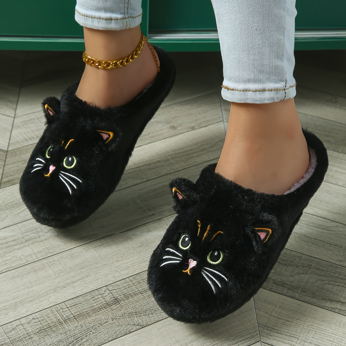 Cozy cartoon cat eyes winter plush slippers with soft sole, fluffy material, and hand washable. Perfect for cold weather and comfort. Ideal for indoor use.