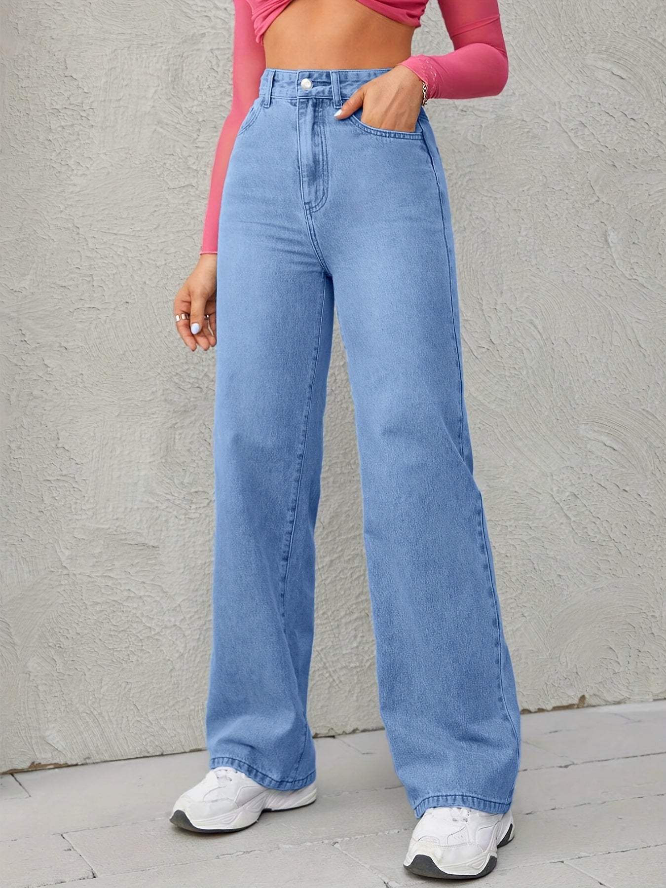 Sky blue wide leg jeans for women with high waist, loose fit, and medium elasticity.