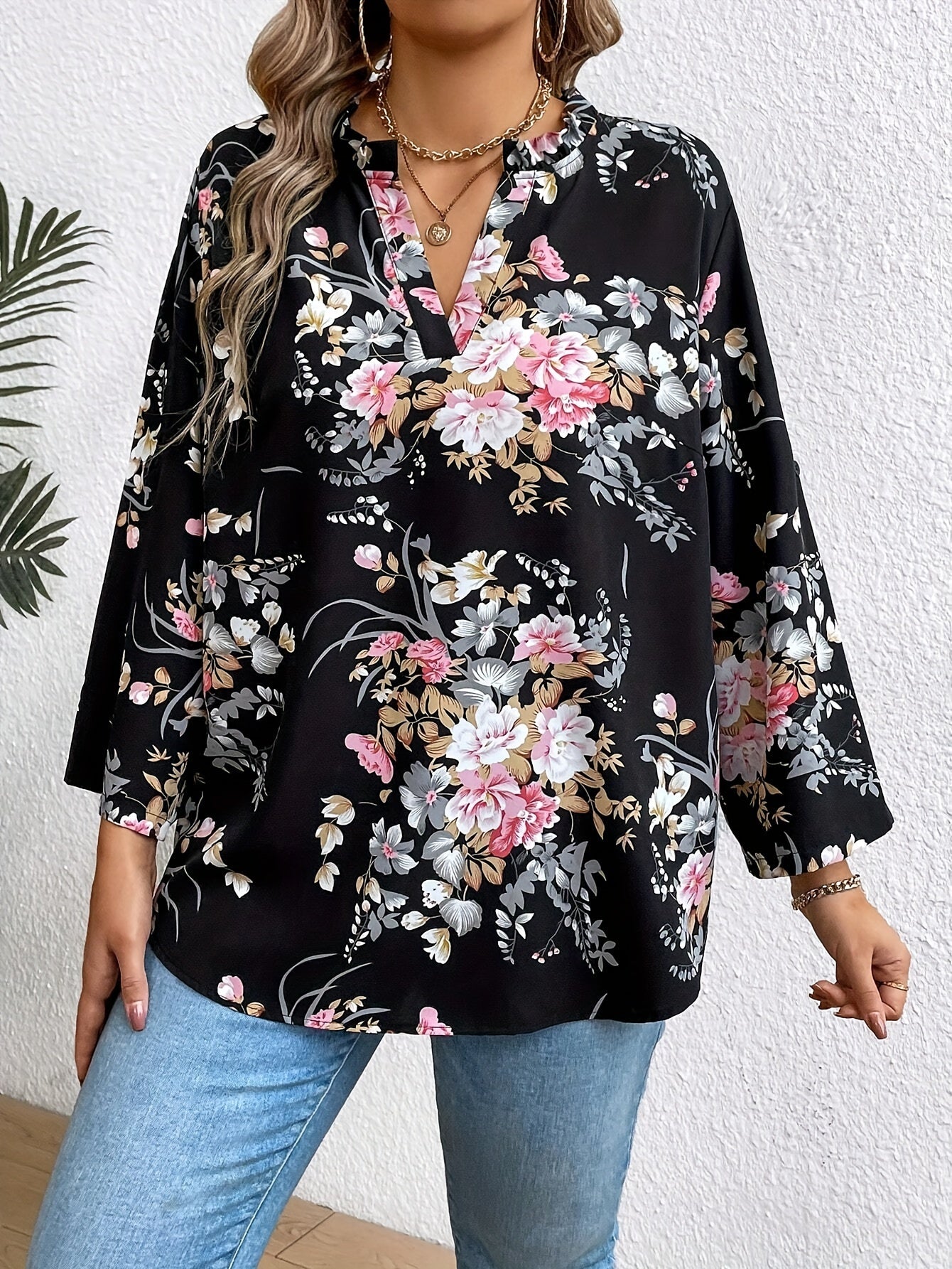 Elegant plus-size women's floral print blouse with ruffle sleeves in stylish black, perfect for casual to semi-formal occasions.