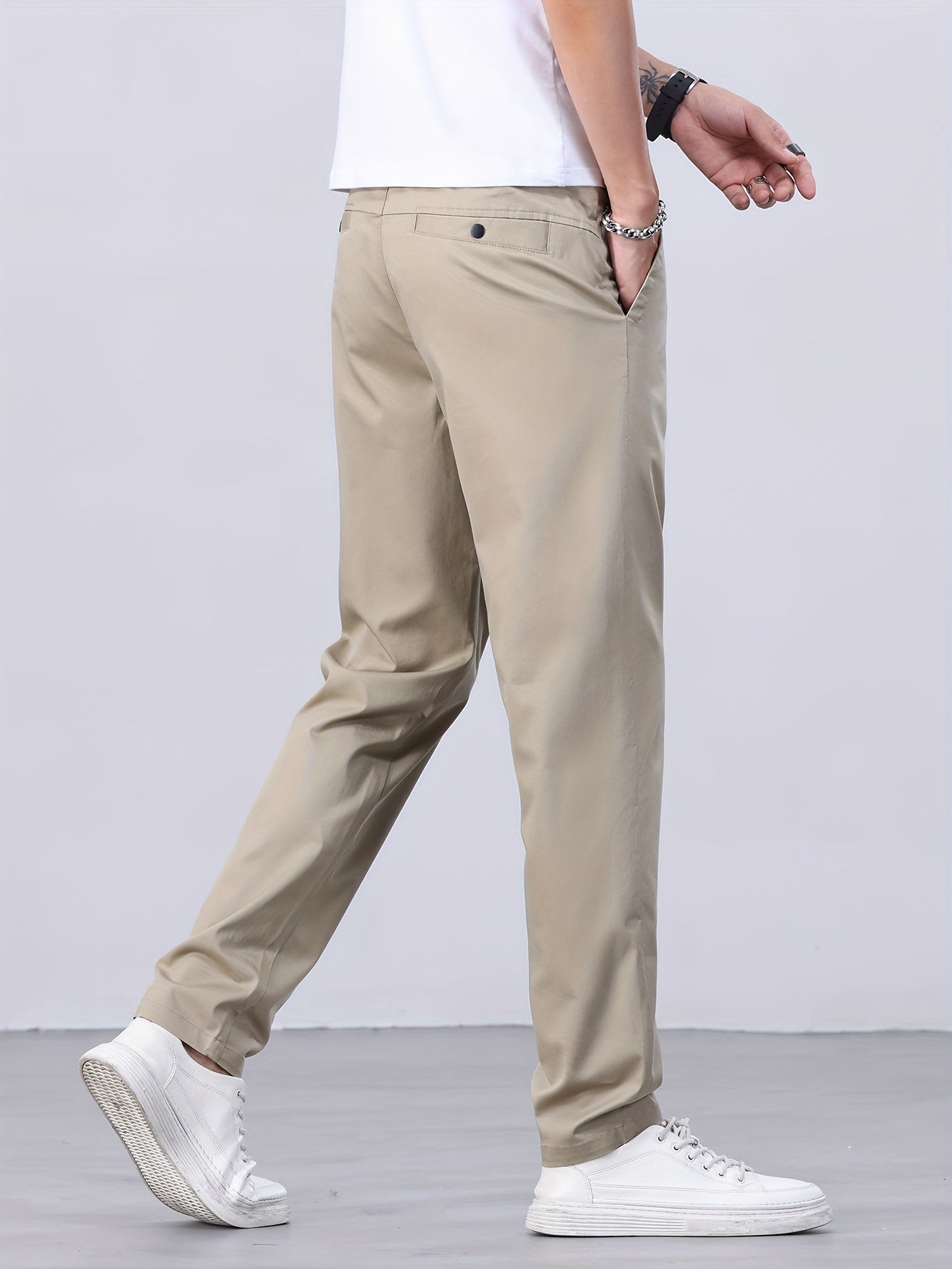 1 Men's all-season casual pants in caramel color, made of cotton blend with slight stretch and regular fit, featuring mid waist, pockets, zipper fly, and woven work style for weekend casual.