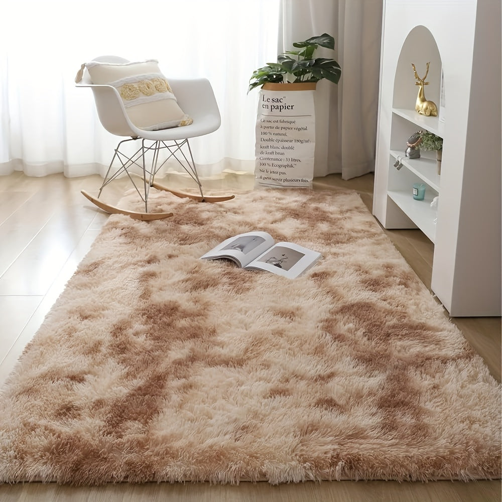 Soft shaggy area mat with a tie-dye design, made with 260g polyester and a 0.6cm thick sponge base. Features a 21 density for added comfort. Machine washable and suitable for indoor use in living rooms, bedrooms, game rooms, and dorms. This Nordic style