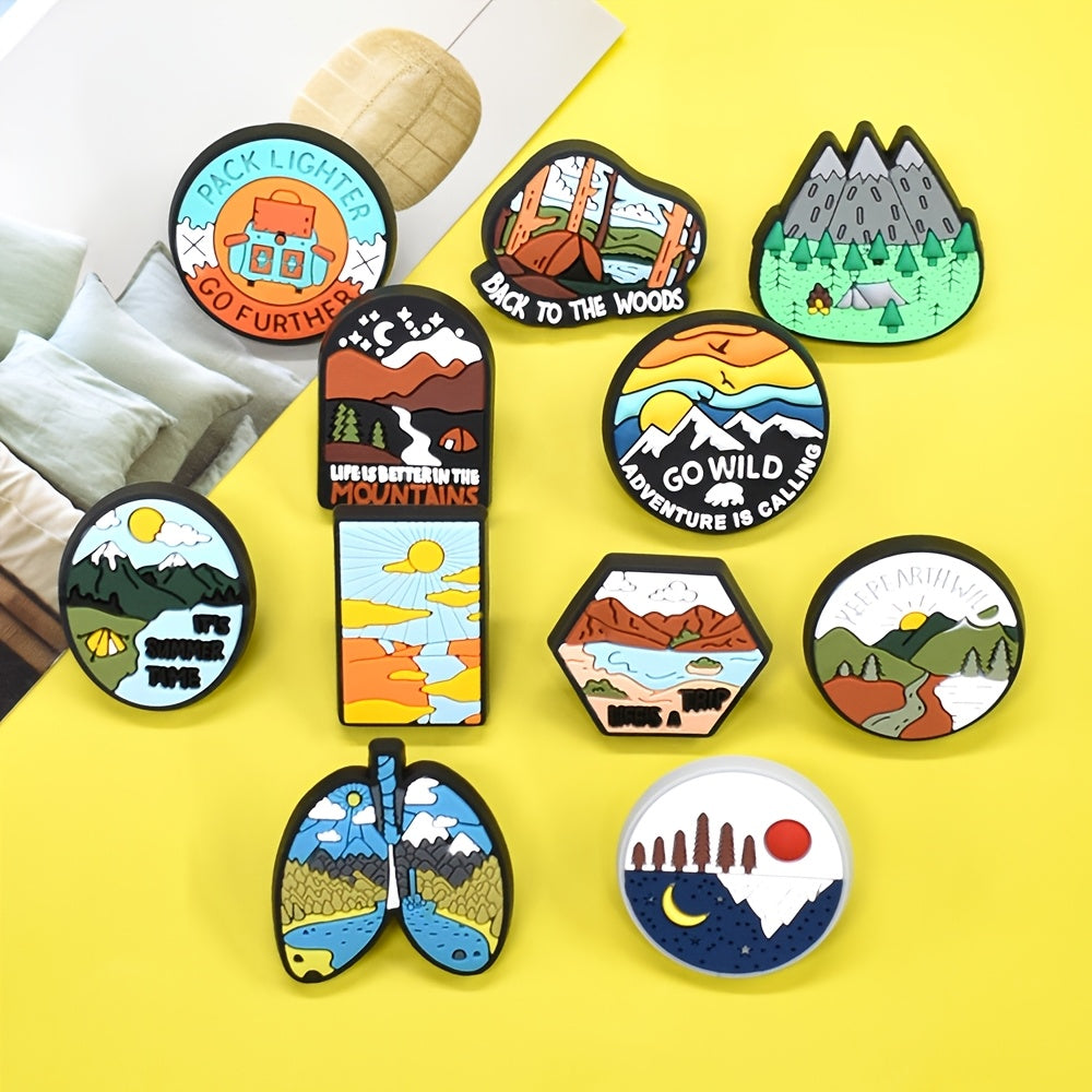 A set of 16 adventure-themed plastic brooch pins featuring travel and nature inspired designs such as trees, rivers, mountains, sun, car, and tent motifs. Perfect for backpack accessories, this holiday gift pin set is sure to inspire any nature lover.