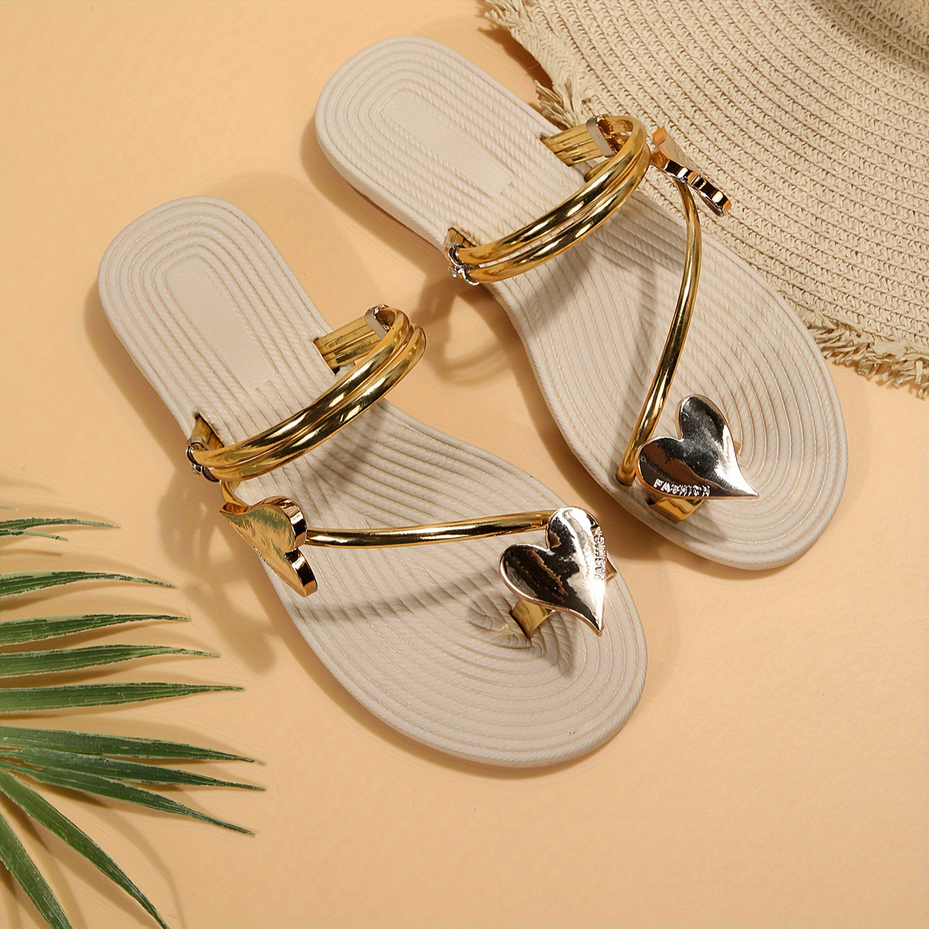 Stylish summer sandals for women with heart accent, easy slip-on, flat heel, and comfortable clip toe design. Available in sizes 5-10.5.