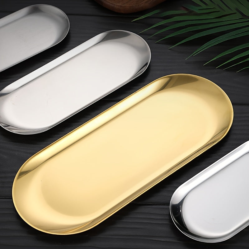 Elegant golden stainless steel tray for makeup, perfume, jewelry, and bathroom decor with an artistic design and sink organizer.