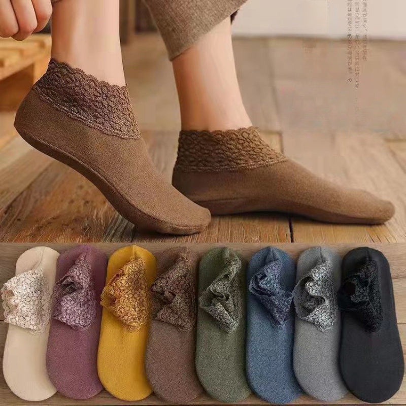 5 pairs of women's lace trim ankle socks with cozy silicone grip, perfect for winter and all-season wear. Made from a blend of polyester and spandex, these elegant slipper socks are machine