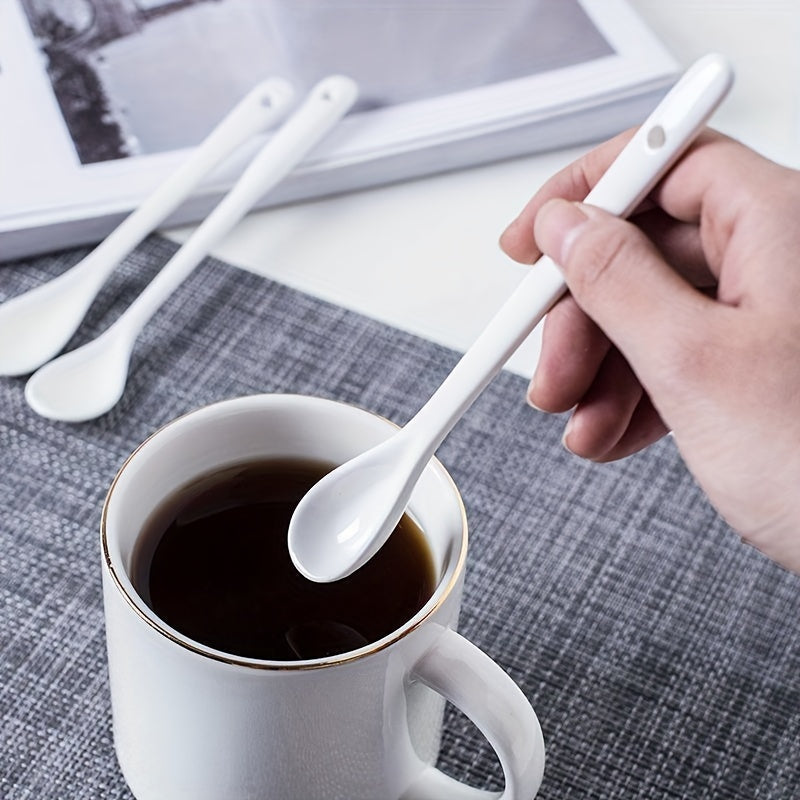 A set of 10 ceramic spoons with a long handle measuring 12.95cm, made of white porcelain for serving coffee, soup, seasoning, and espresso. Perfect for adding an elegant touch to your kitchen and dining essentials.