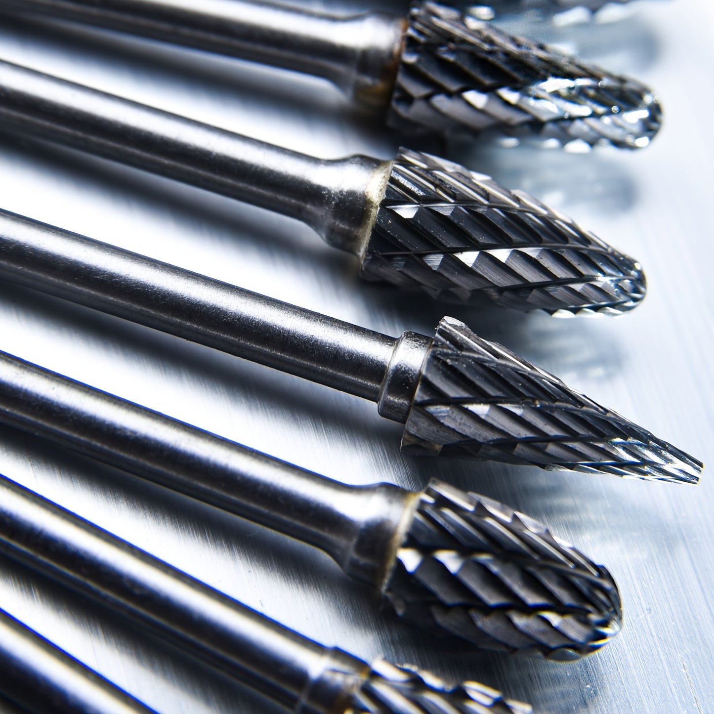 10-piece set of high-performance tungsten carbide rotary burrs with 1/8" shank for precise grinding and carving. Double cut for efficiency.