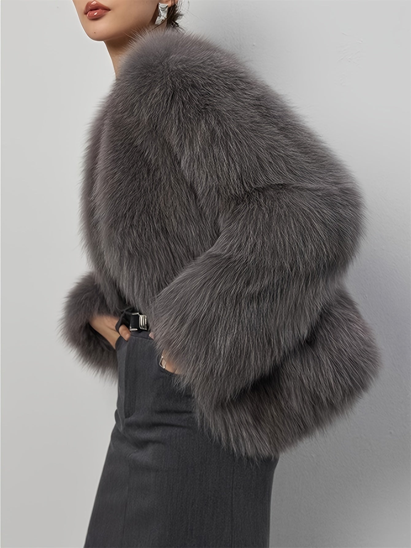 Stylish women's coat in light gray faux fur with fluffy collar, perfect for cold weather