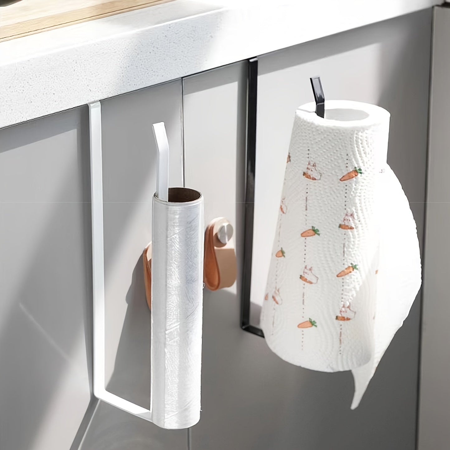 Easy to install under-cabinet paper towel holder, made of space-saving metal rack for kitchen use. Ideal for holding dishcloths and oil-absorbing sheets, no drilling necessary. Sleek metal design with iron construction, perfect for organizing kitchen