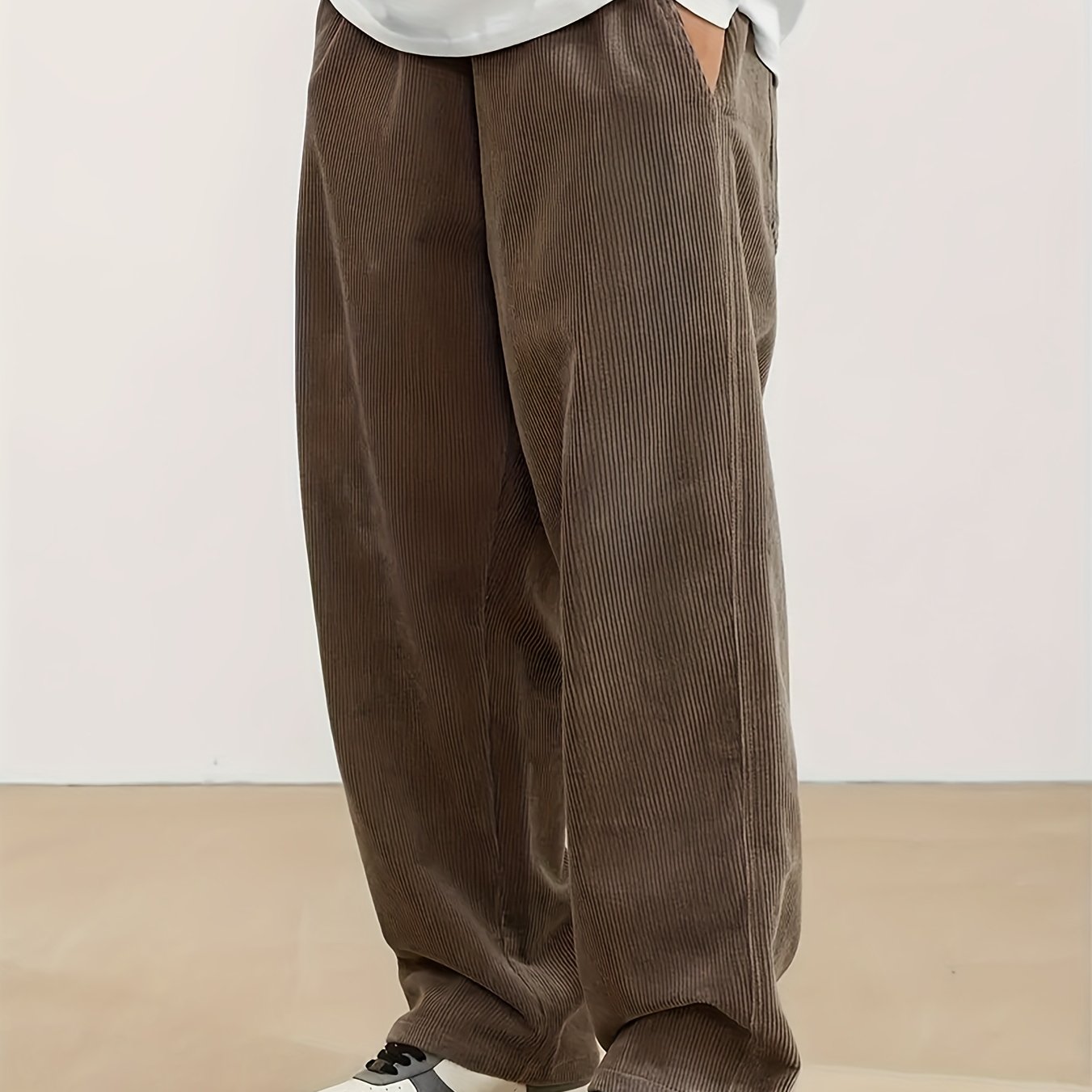 Plus size men's corduroy pants with drawstring, pockets, and straight-leg fit, made from 100% breathable polyester fabric for urban streetwear or outdoor activities.