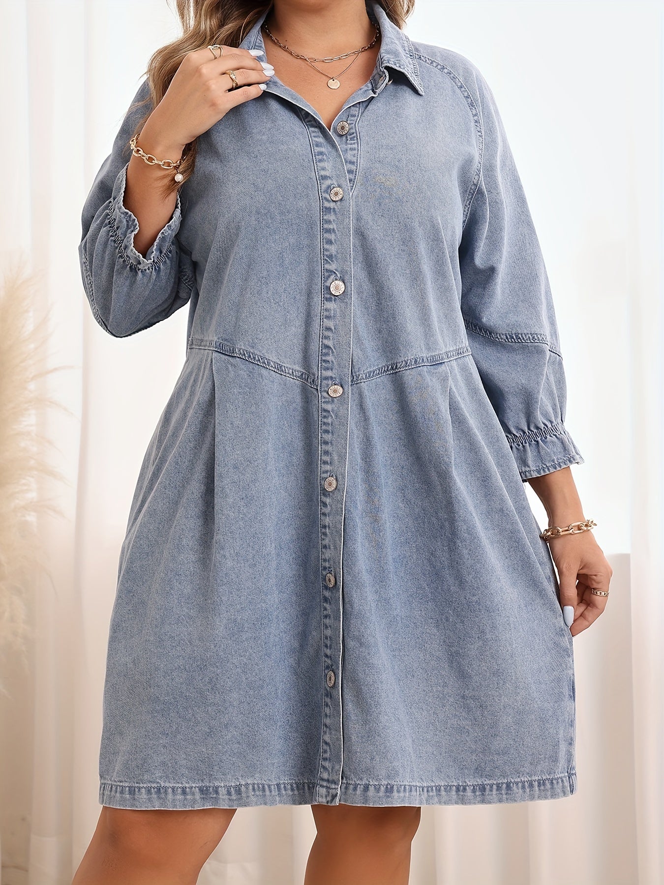 Casual denim shirt dress with ruffle hem in light blue for plus size women.