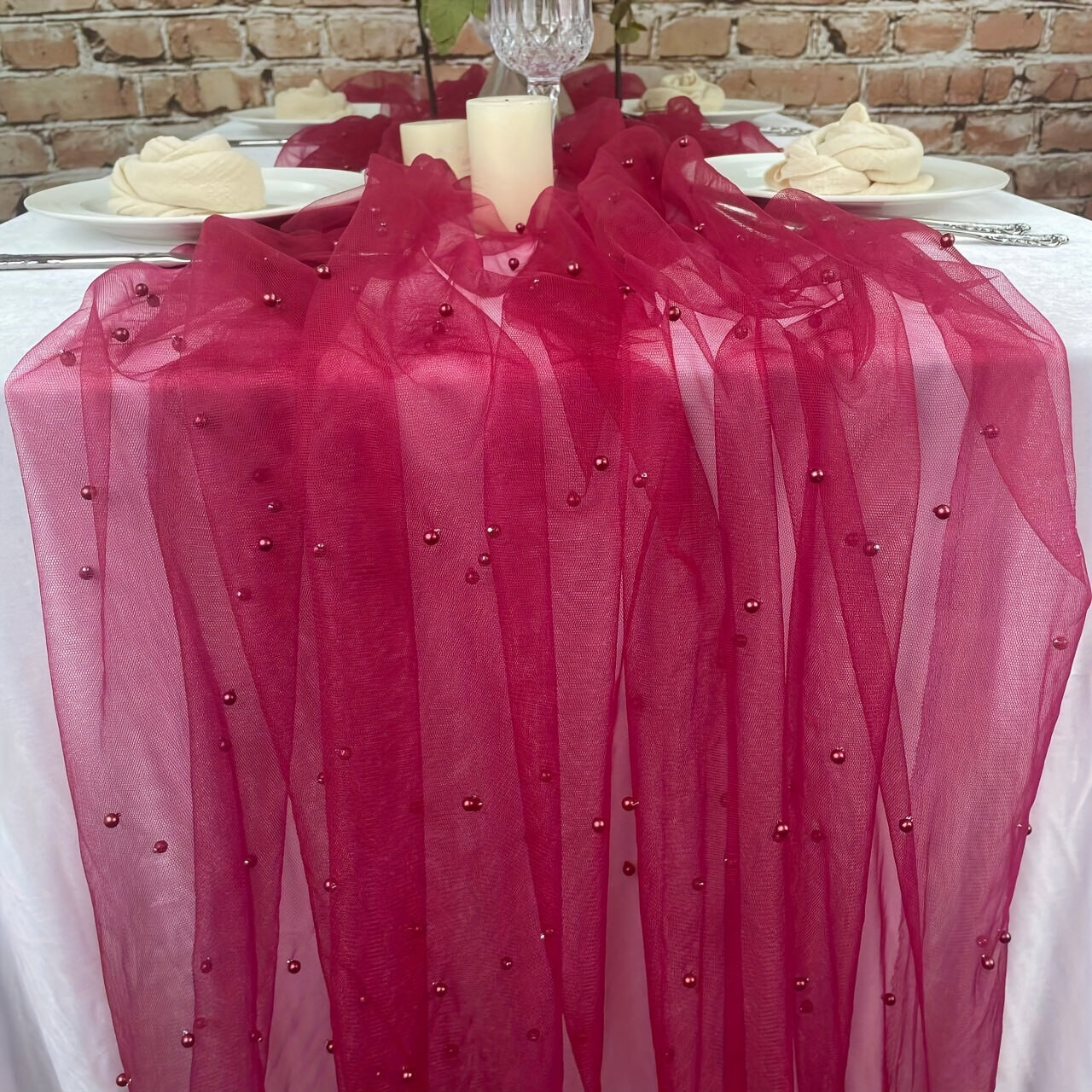 Elegant pearl bead tulle table runner, perfect for weddings and parties. Can also be used as a chair sash or backdrop drape. Made from 100% polyester fabric with delicate bead detailing.