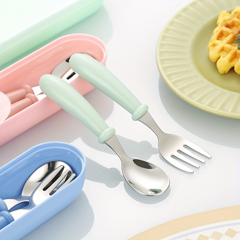 Set of 3 stainless steel youngsters' utensils with colorful handles, dishwasher safe. Includes fork and spoon in blue geometric pattern in pink and green cases.