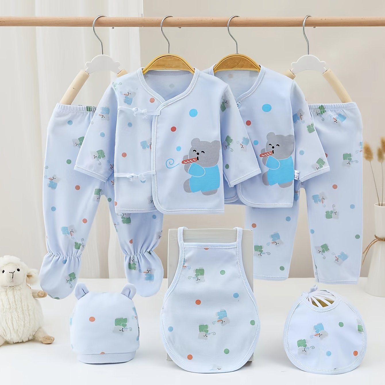 Comfy 7-piece cotton set for baby girl featuring bear and rabbit cartoons. Easy care and versatile wear.