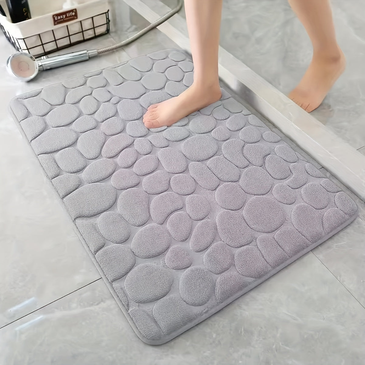 One piece of pebble pattern non-slip and absorbent polyester foot mat that can be hand washed. Ideal for use in the bathroom, bedroom, and kitchen to absorb water and reduce slipping. Great for keeping your bathroom floor safe and dry.