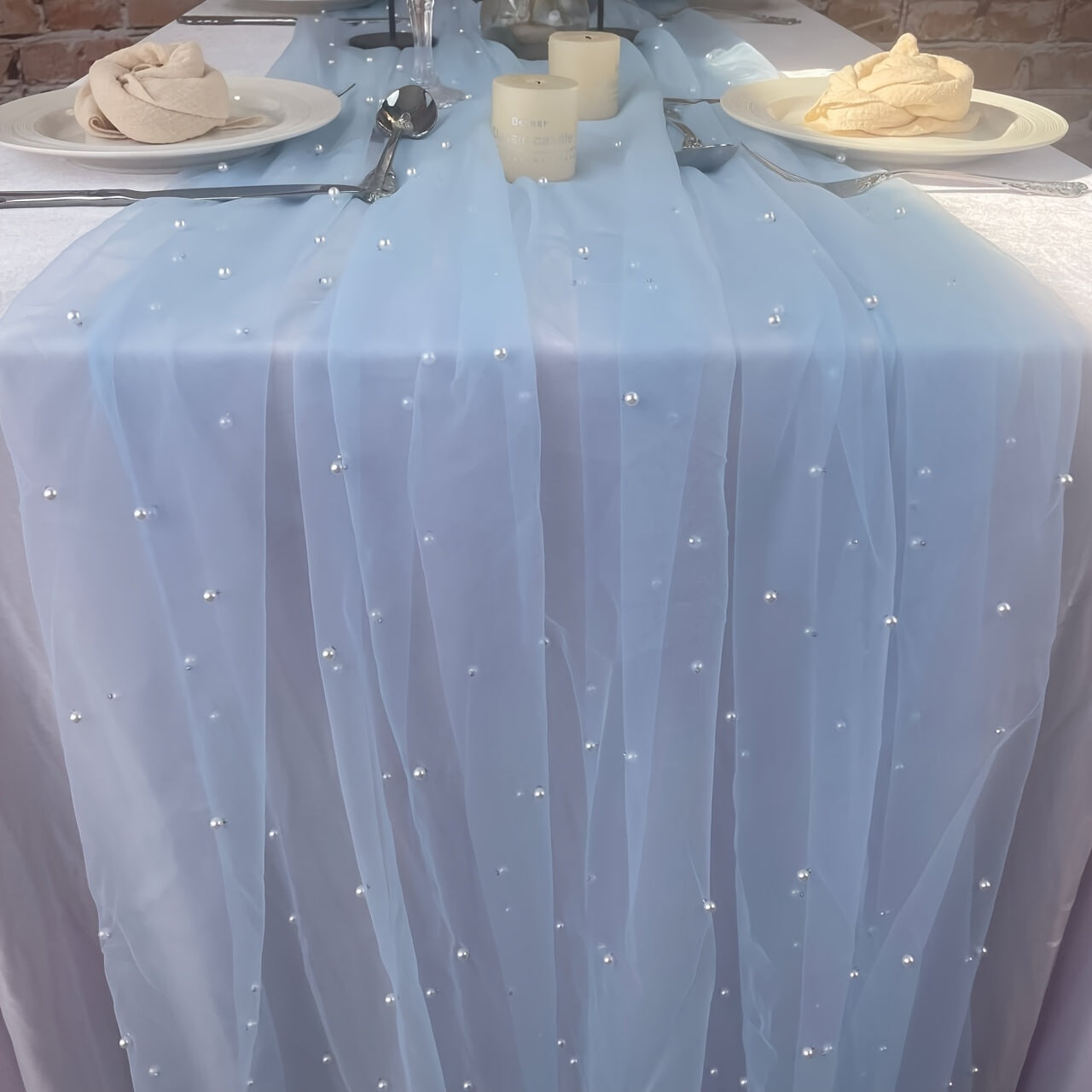 Enhance the ambiance of your special events with our Romantic Pearl Lace Table Runner. Perfect for weddings, bridal showers, and more, this elegant decoration is crafted from embroidered sheer chiffon tulle that is wrinkle-free for a luxurious look.